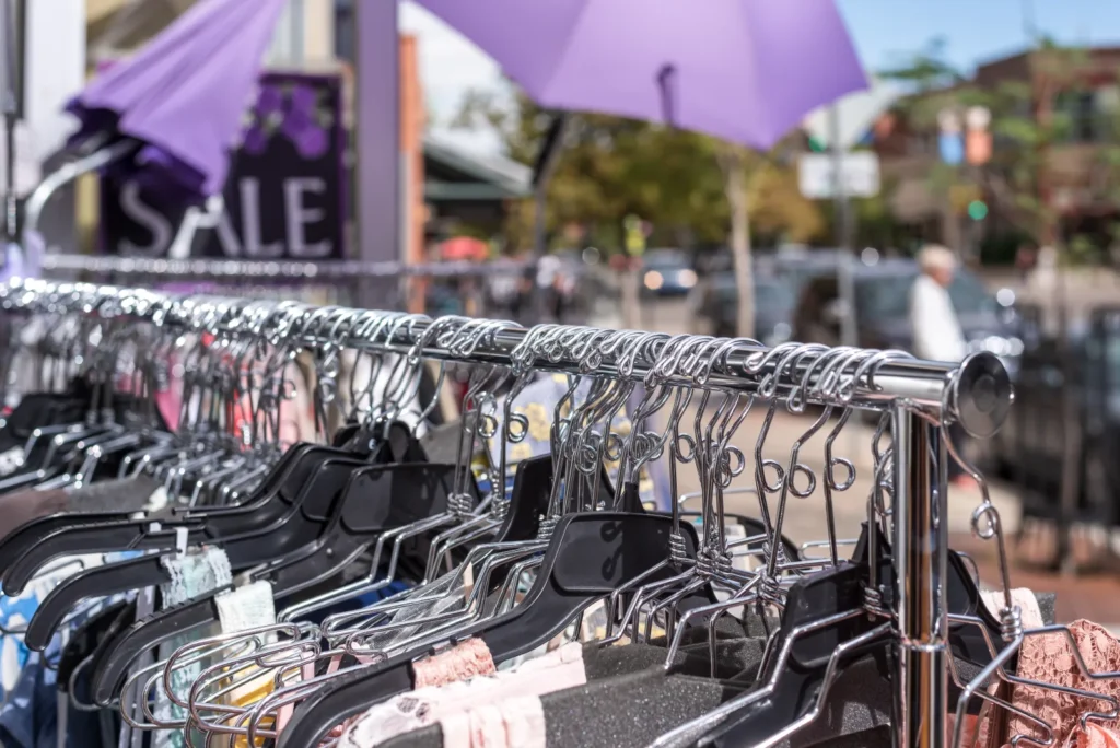 A close view of curated clothing on a rack